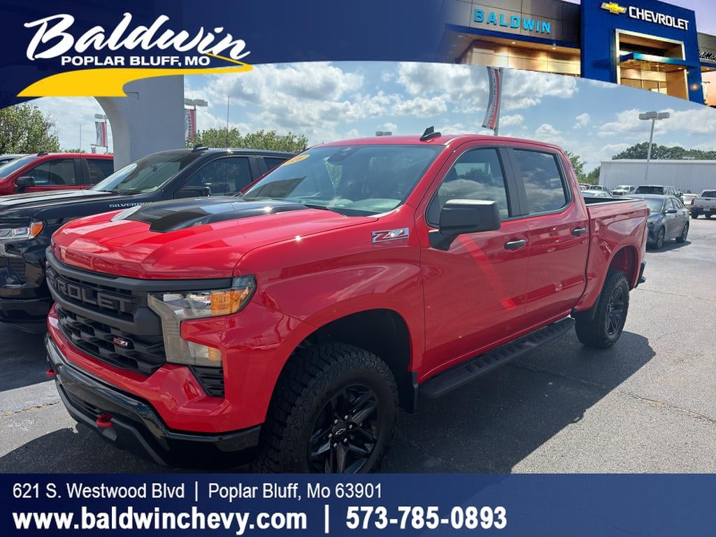 2026 Chevrolet Silverado 1500 Custom Trail Boss in Red Hot — front three-quarter view